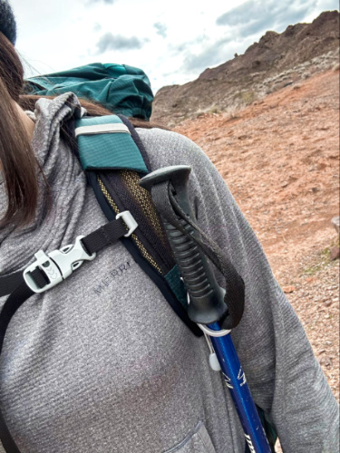 View of the trekking pole attached to the strap of the Osprey Eja Backpack
