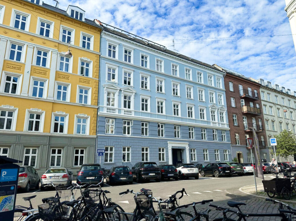 The colorful residential buildings lined along the street