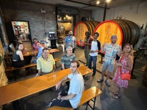 People smiling for a photo during the Travel Lemming's Chicago Community Meetups