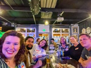 People smiling for a photo during the Travel Lemming's Nashville Community Meetups