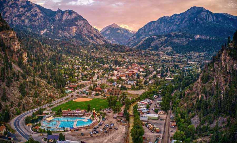 Aerial view of a mountain town with hot springs