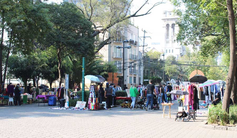 People gathered in the outdoor clothing weekend market in Mexico City