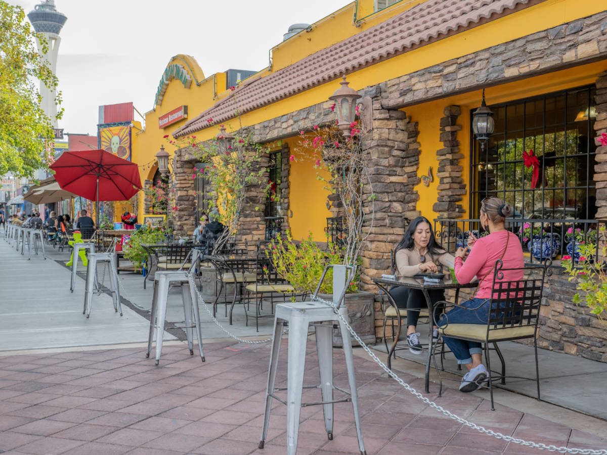 People enjoying their food on an al fresco dining in Arts District