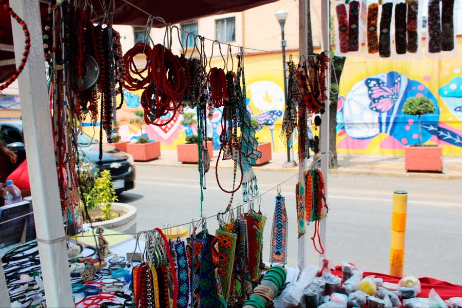 View of colorful items from an outdoor stall in Mercado de Artesanias La Ciudadela