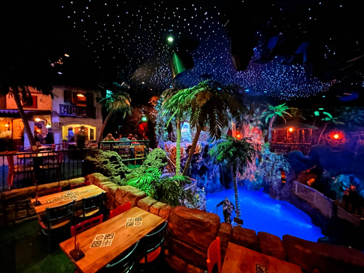 View of the pool and the outdoor patio of Casa Bonita at night