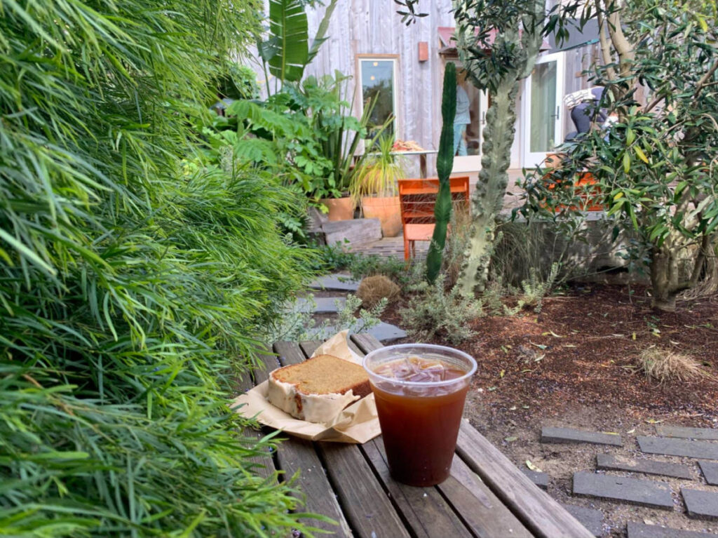 Coffee and bread outside Outside Black Bird Bookstore and Café