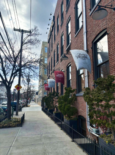 View of the exterior and banners of Henry Norman Hotel