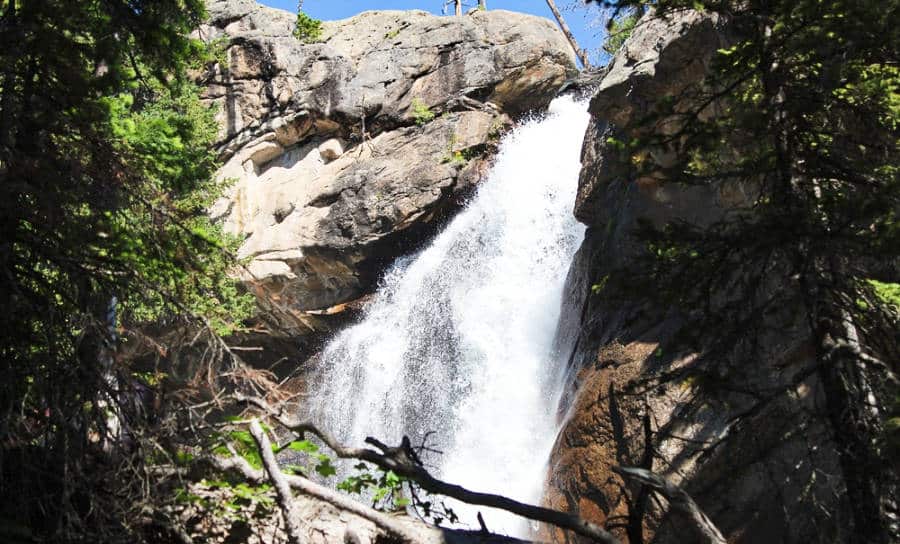 View of the Ouzel Falls cascading down on the trail
