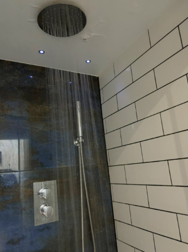 The overhead water stream in the shower
