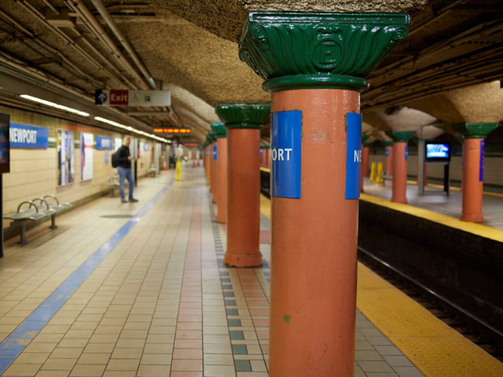 A man waiting for a train at the PATH Train Station