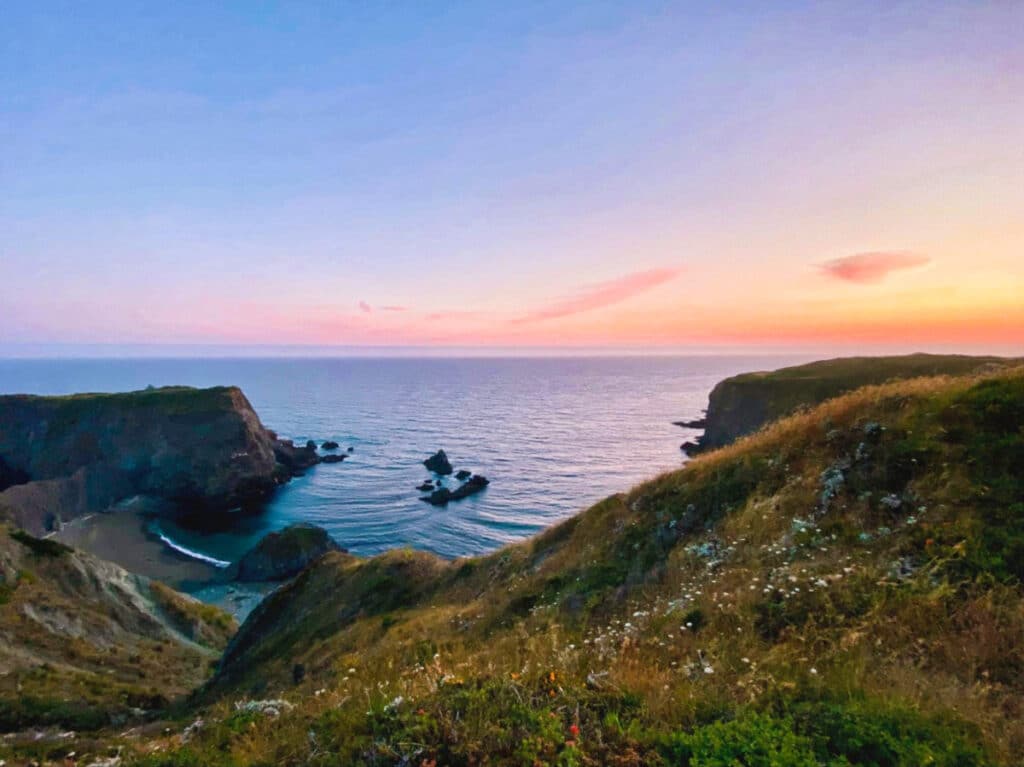 View of the beautiful sunset over the Pacific Ocean in Jenner