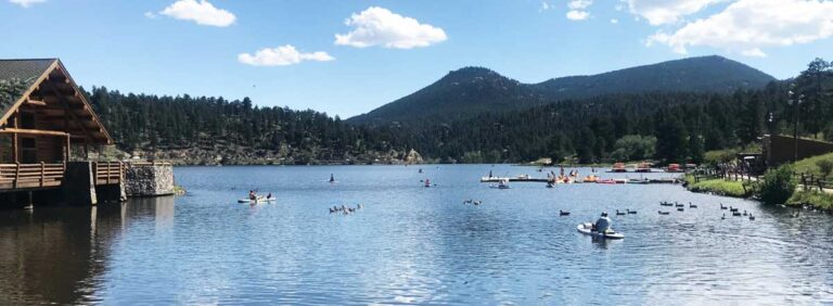 People enjoying paddle boarding in Evergreen Lake