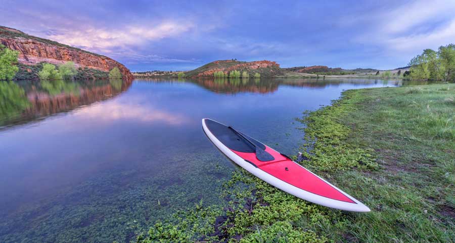 A paddleboard and a paddle in Horsetooth Reservoir