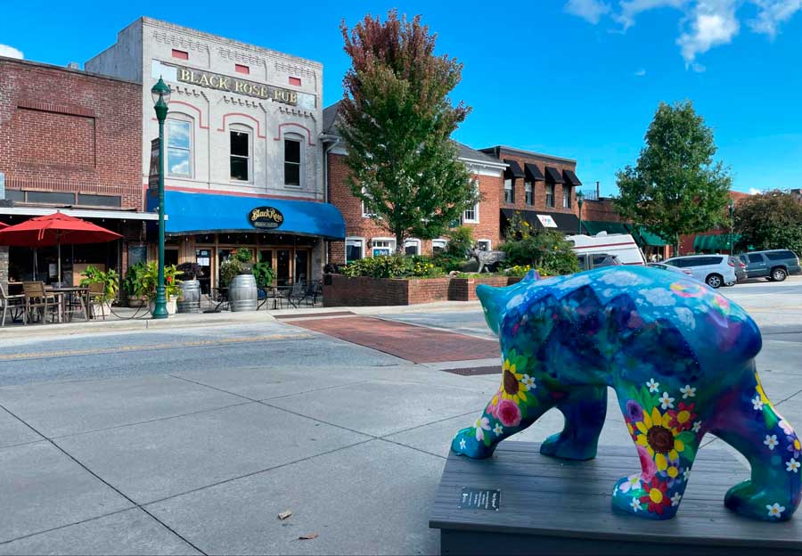 A colorful painted bear statue in Downtown Hendersonville