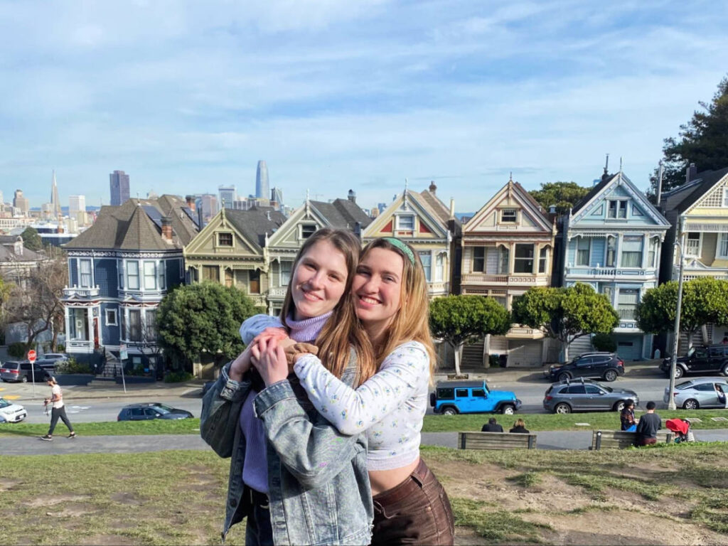 The author, Laura McFarland with her friend and the Painted Ladies on their background