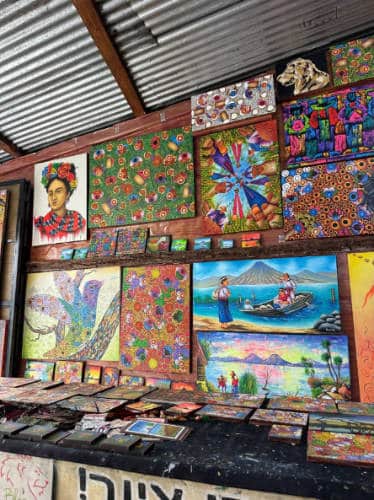 Colorful paintings displayed on a shop