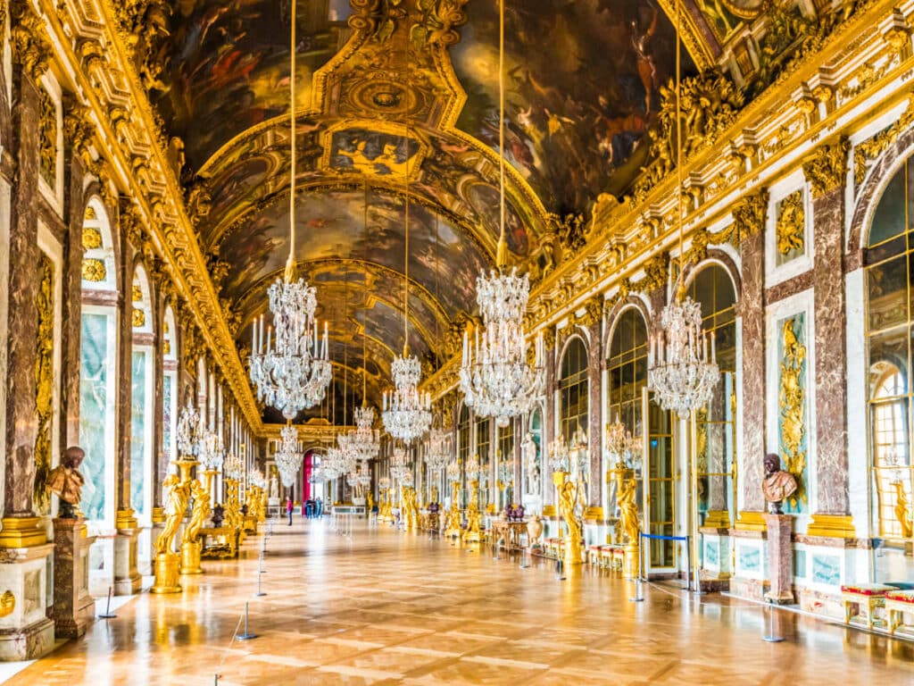 View of the luxurious Hall of Mirrors inside the Palace of Versailles