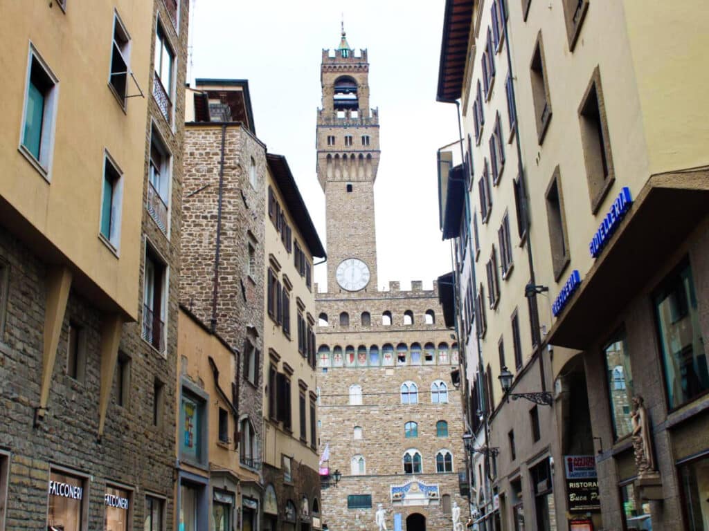 View of the Palazzo Vecchio in between the street in Florence