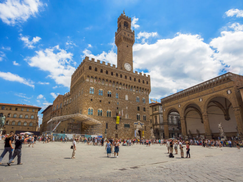Crowds of people at the Square of Signoria with Palazzo Vecchio