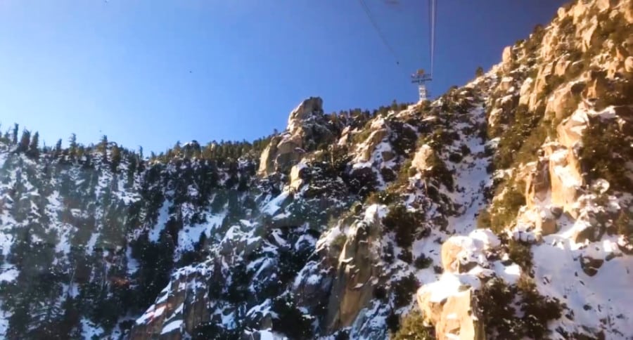 View of the mountain with snow from the moving aerial tram in Palm Springs