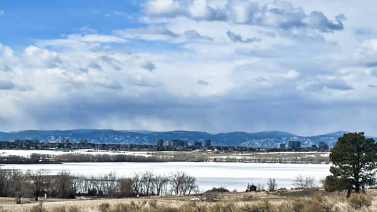 Panoramic view of the Aurora skyline and snow covered landscape at a park