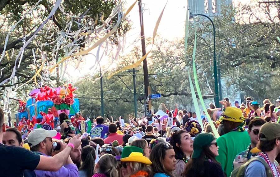 View of people during a parade in Uptown New Orleans