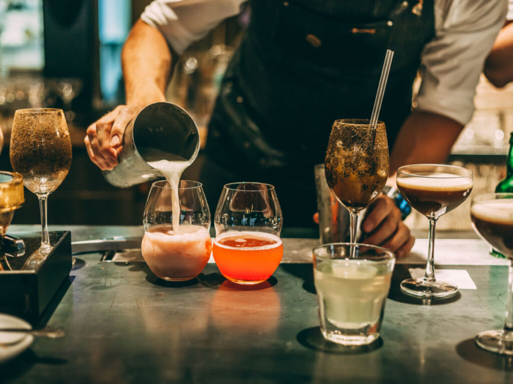 Bartender making alcoholic cocktail at Paradiso