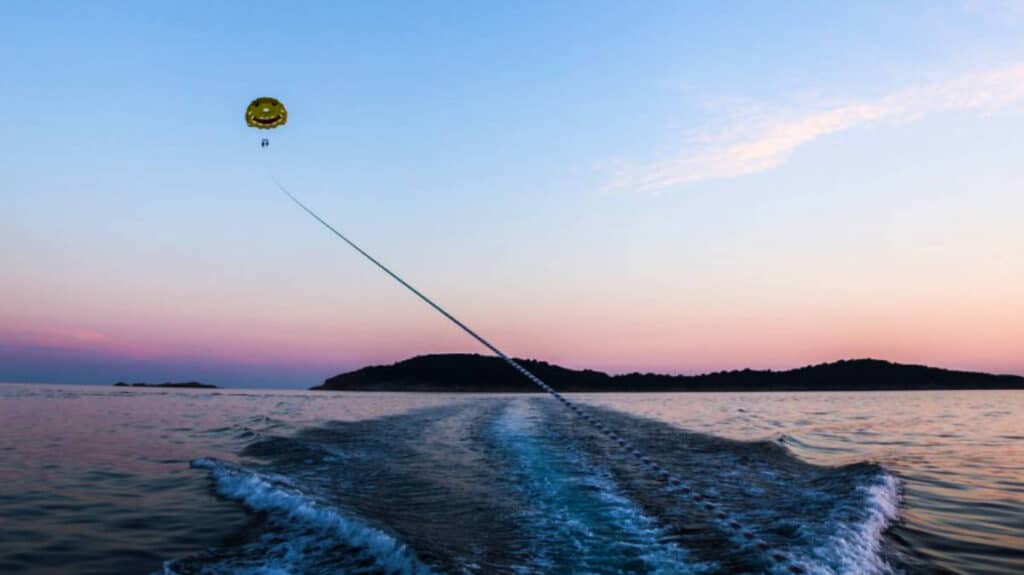 Taylor Herperger with a friend parasailing in Cavtat at sunset