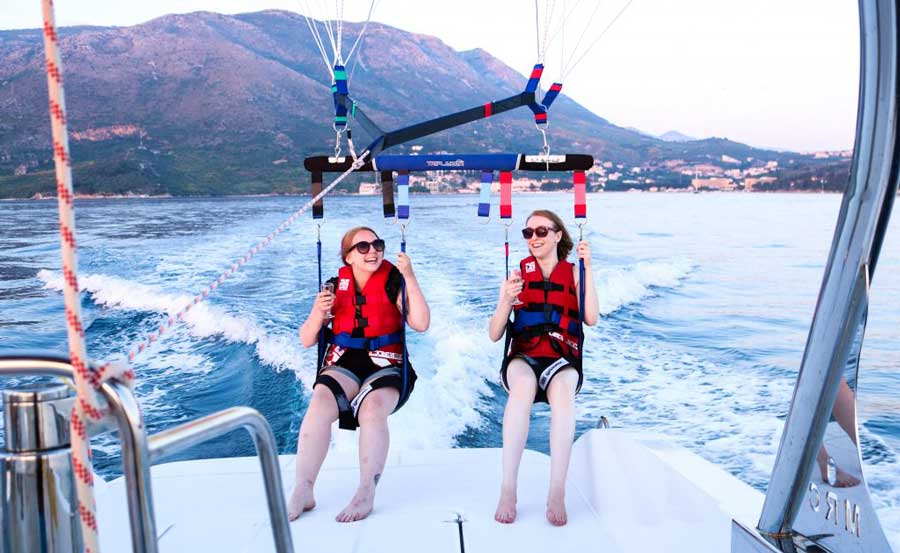 The author with her friend parasailing in Croatia
