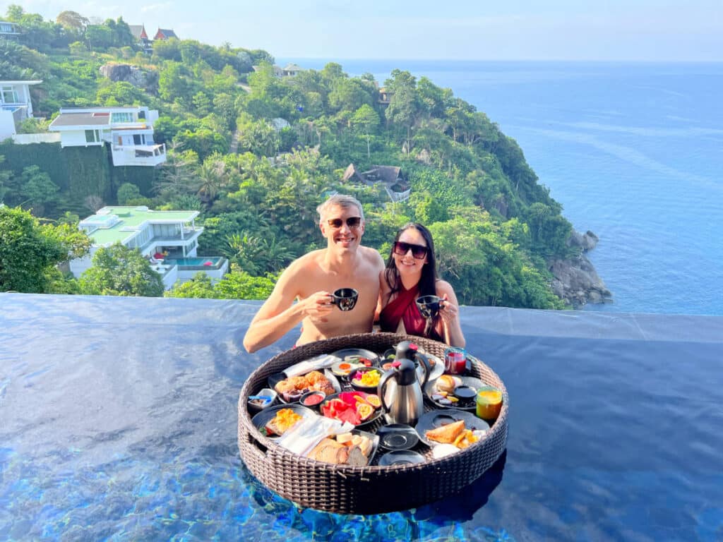 Nate Hake and Clara Kesseler at Paresa Resort in Phuket, in a pool with an ocean view and a floating breakfast