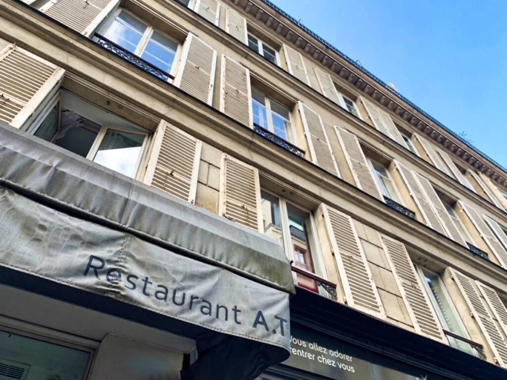 View of the awning and exterior of AT restaurant