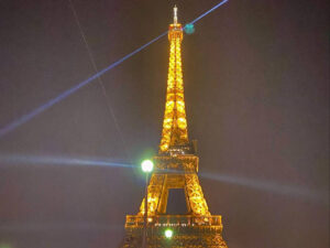 The Eiffel Tower with lights at night in Paris
