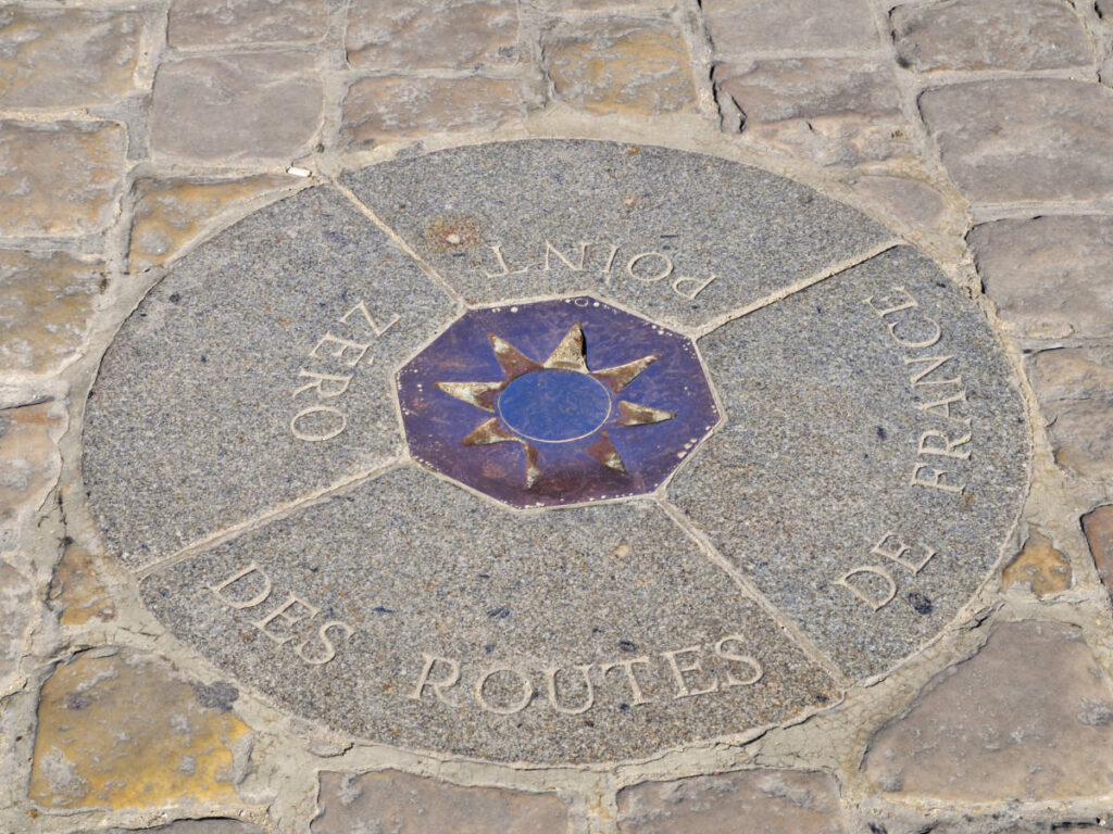 View of the Point Zero signage on the road of Paris