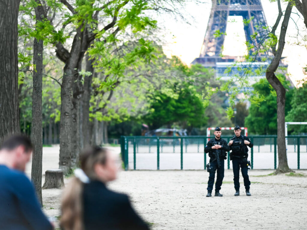 View of the police officers with the Eiffel Tower in the background
