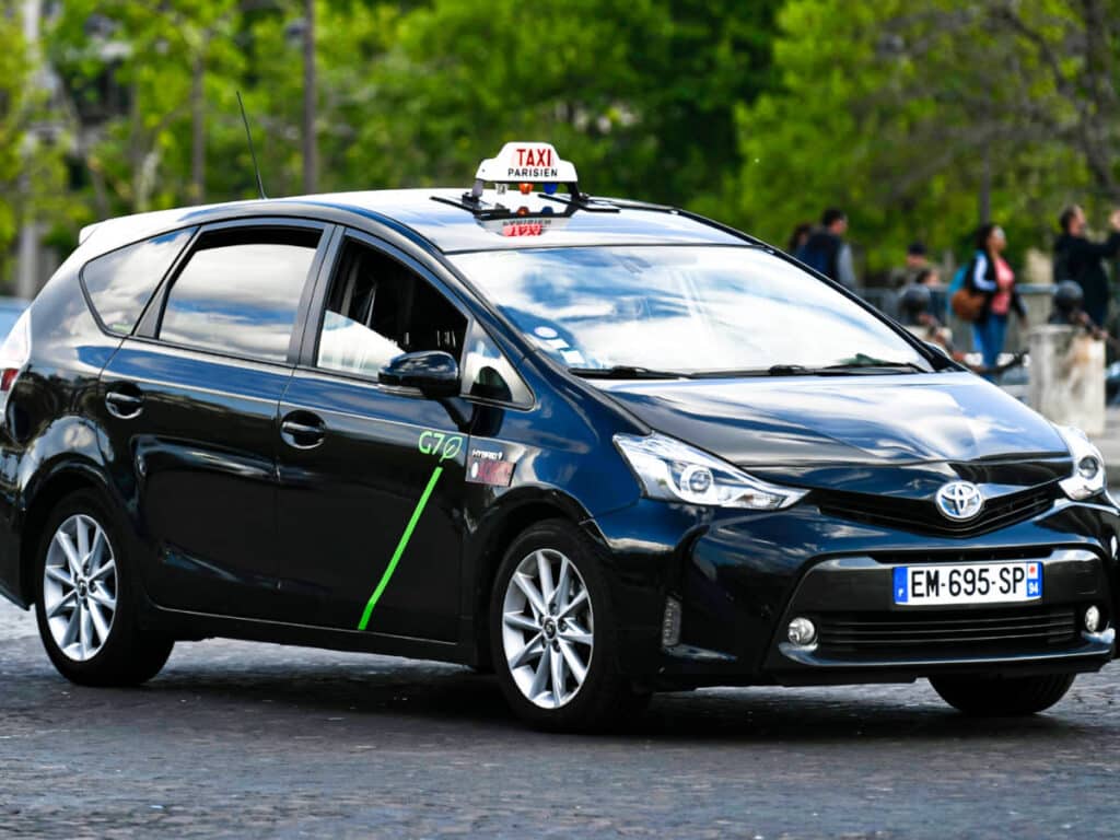 A closeup look of a licensed taxi on the road