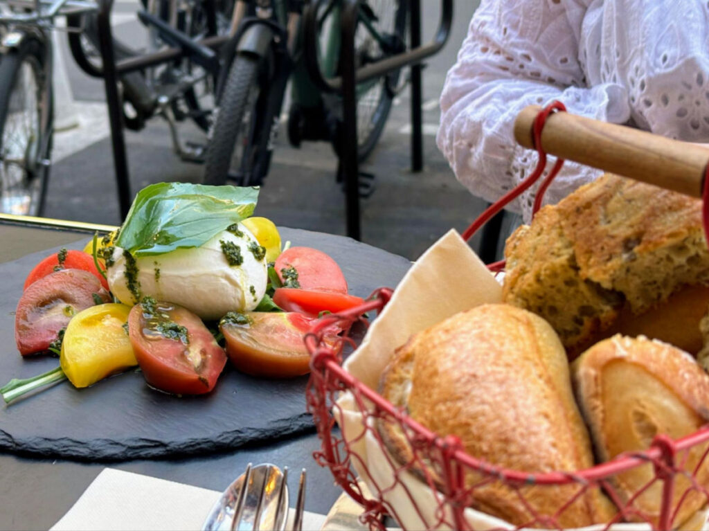 Fresh bread, tomatoes, pesto, and cheese