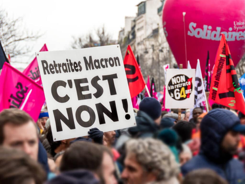 View of the Parisian protesters holding banners and signages in the middle of the street