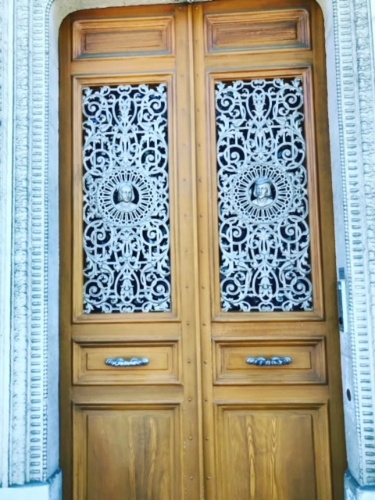 Wooden doors featuring intricate Parisian designs