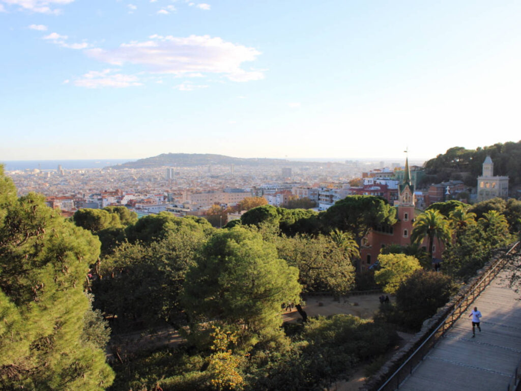 A man running on the walkway in Park Güell
