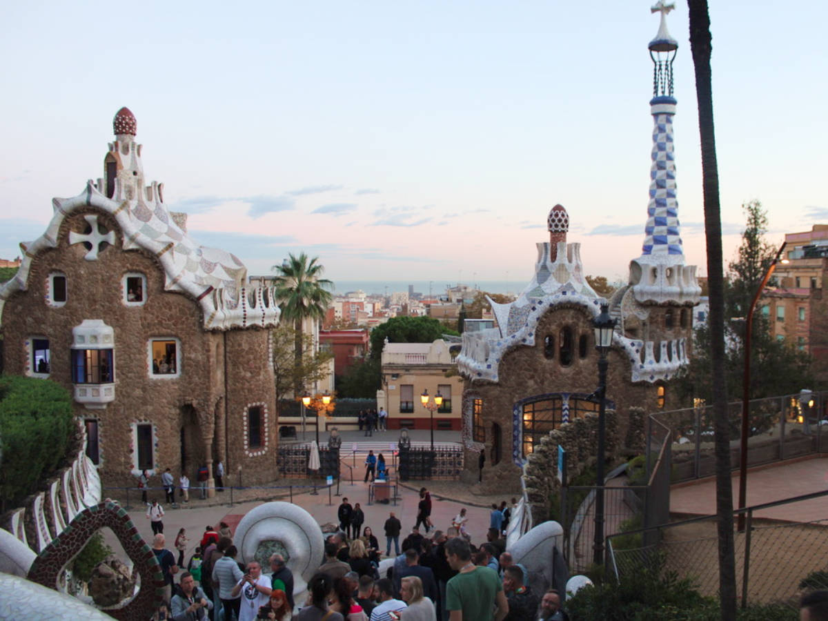 View of the Gingerbread houses at the entrance of Park Güell at sunset