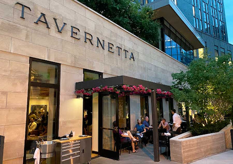 People enjoying their food outside the Tavernetta