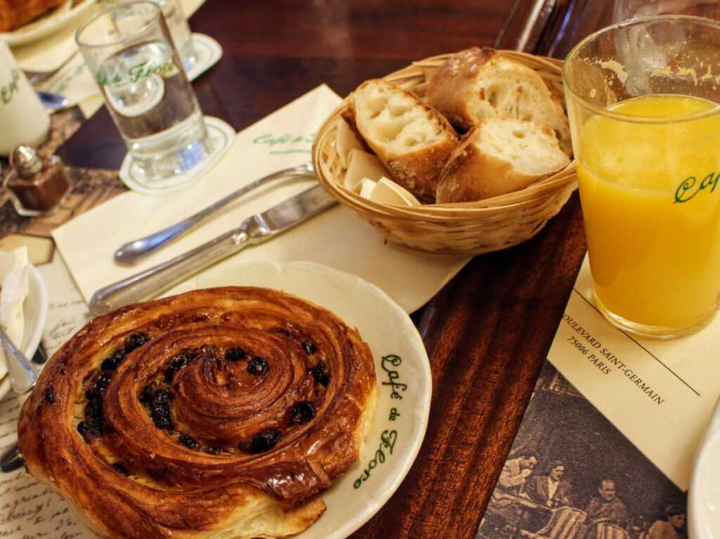 Plates of Pastries and orange juice at Café de Flore