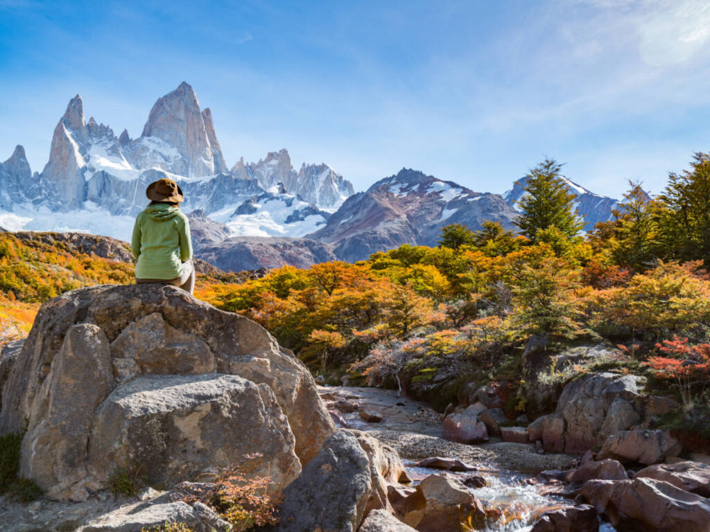 A woman admiring the view in Patagonia during fall season