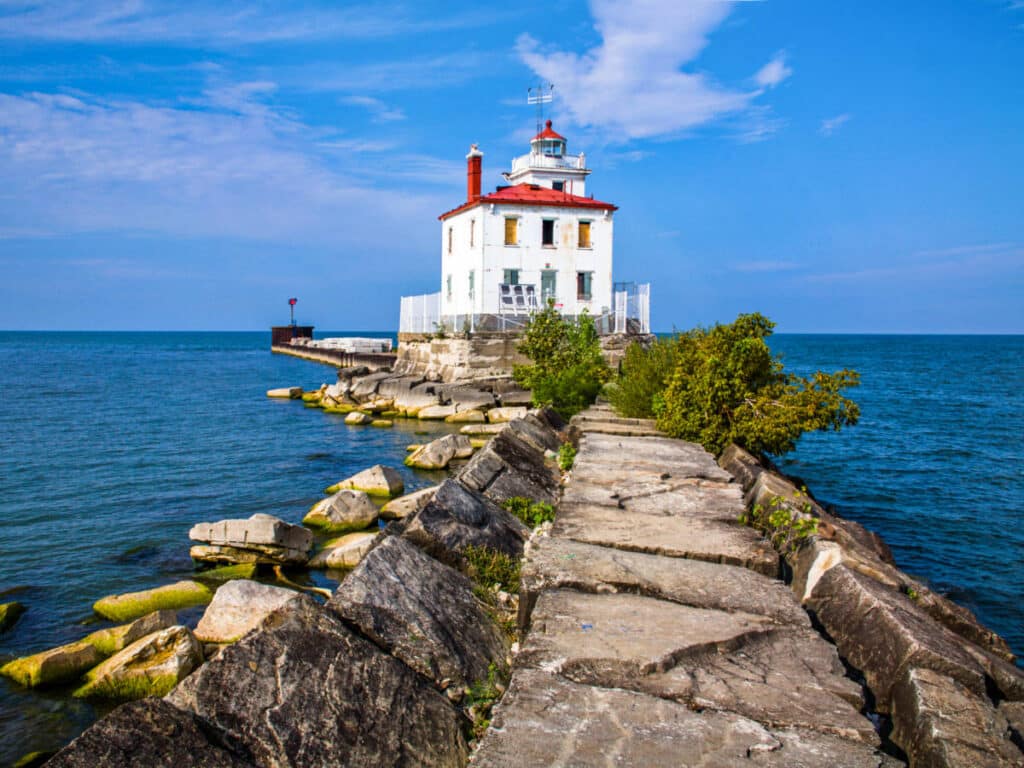 View of the rocky pathway leading to the West Breakwater Lighthouse of Fairport Harbor Lakefront Park