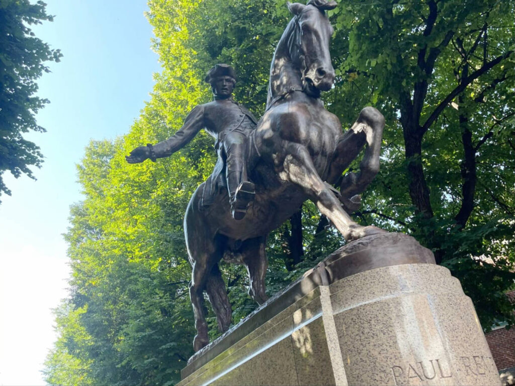 A monument of Paul Revere riding a horse at the Freedom Trail