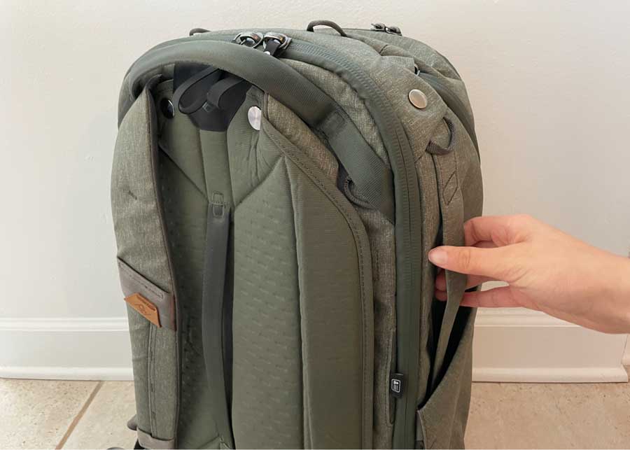 The author holding one of the grab handles of the Peak Design Travel Backpack