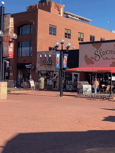 View of shops under the clear blue sky in Pearl Street Mall