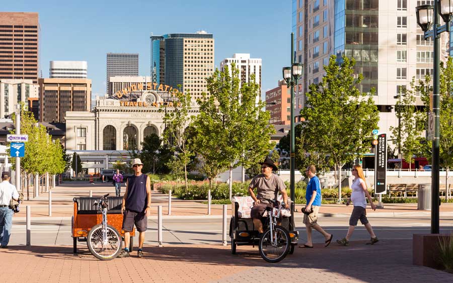 View of people and pedicabs in Denver