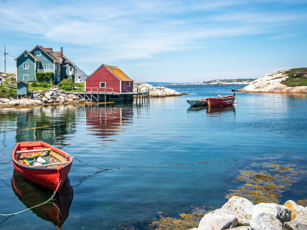 View of the boat house and the boats on the water at Peggy's Cove