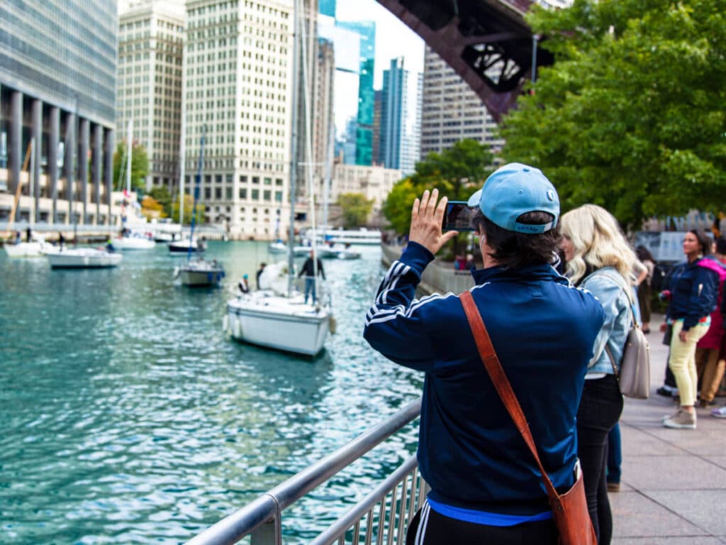 View of the people wandering and taking a photo from the Chicago Riverwalk